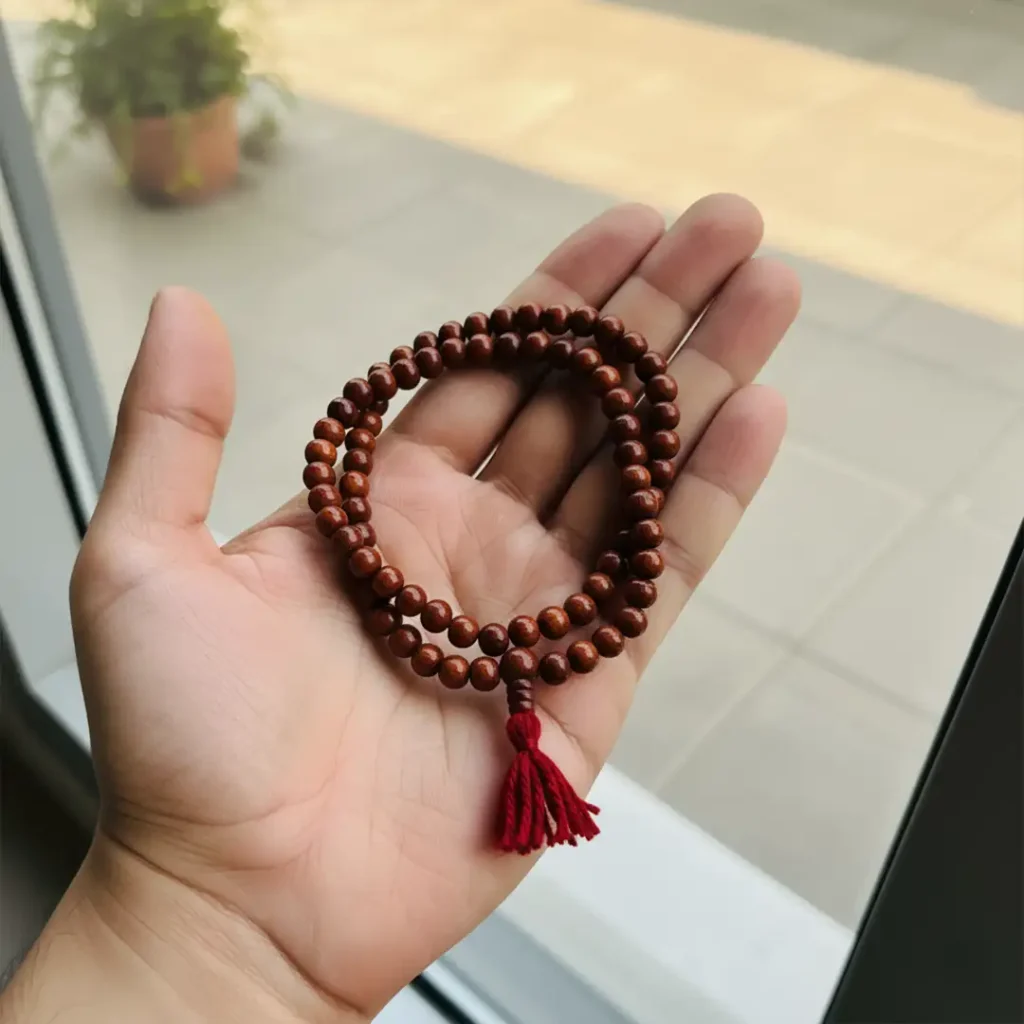chandan mala in hand